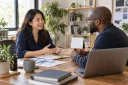 A business owner and web professional discussing the next steps for a website project.