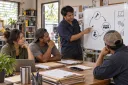 Repair-company staff review their service, feedback and repeat-customer cycle.