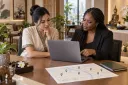 The owner and operations lead review anonymous feedback before deciding what system to build next.