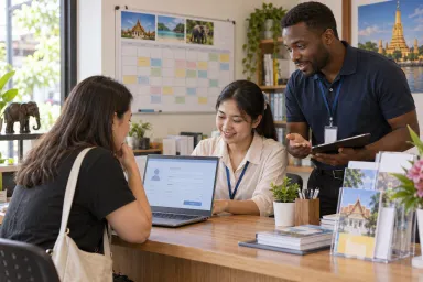 A training-center administrator helps a student enter an enquiry while an advisor discusses the course schedule.