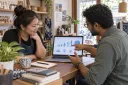 A shop owner and web advisor review a simple site analytics dashboard after launch.